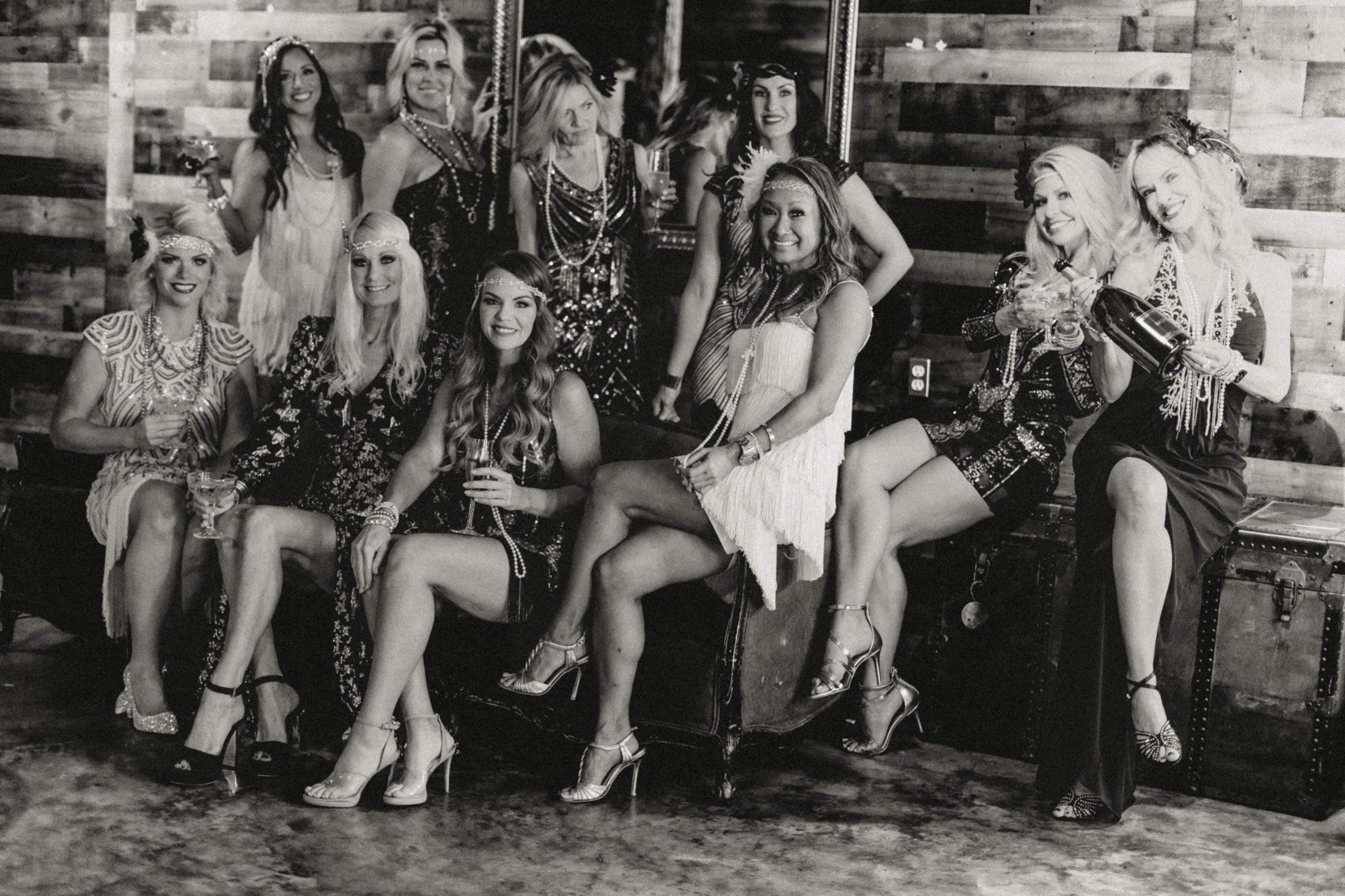 Gatsby Girls in vintage-inspired gowns, feathers and pearls